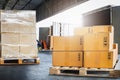 Package Boxes Stack on Wooden Pallets Loading into Container Trucks. Supplies Warehouse Shipping. Supply Chain, Shipment. Royalty Free Stock Photo
