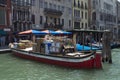 Package delivery boat loaded with parcels parked on the Canale Grande in Venice.