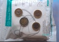 Package of FFP2 protection masks and money coins against Covid-19