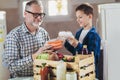 Package of fresh groceries to a stay-at-home father and his son.