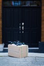 A package sitting in front of a residence that has been delivered by an autonomous drone