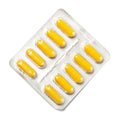 Package of yellow capsules Royalty Free Stock Photo