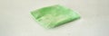 Packaged green microfiber cleaning cloth on light surface for household Royalty Free Stock Photo