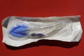 Packaged Laryngeal mask airway for emergency medical help on a red background Royalty Free Stock Photo