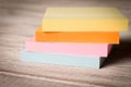 Packages of colorful stickers for notes on a wooden table Royalty Free Stock Photo