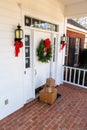 Packages on front porch of home during holiday season Royalty Free Stock Photo