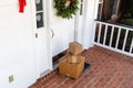 Packages on front porch of home during holiday season Royalty Free Stock Photo