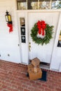 Packages on front porch of home during holiday season Royalty Free Stock Photo