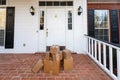 Packages on front porch of home, from online ordering Royalty Free Stock Photo