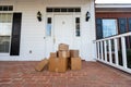 Packages on front porch of home Royalty Free Stock Photo