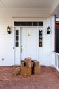 Shipping boxes on front porch of home Royalty Free Stock Photo