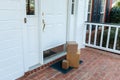 Packages on front porch of home, from online ordering Royalty Free Stock Photo