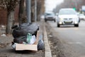 Packages with garbage on the edge of the roadsid