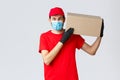 Packages and parcels delivery, covid-19 quarantine delivery, transfer orders. Friendly courier bring order to client Royalty Free Stock Photo