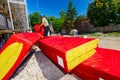 Packages with stone wool arranged in a pile, the workman is hanging the packet with stone wool on the crane hook Royalty Free Stock Photo