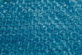 Packaging with air bubbles on a blue background. Bubble wrap texture, packaging, air bubble film. Copy, empty space for text Royalty Free Stock Photo