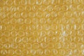 Packaging with air bubbles on a yellow background. Bubble wrap texture, packaging, air bubble film. Top view. Copy, empty space Royalty Free Stock Photo