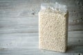 Packaging with Arborio rice on wooden boards