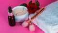 Packaging with blindfolds under the eyes. Cosmetic product. Pink Y-shaped ball roller for facial massage and eye bandages