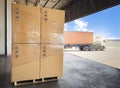 Packaging Boxes on Pallet Loading into Shipping Cargo Container. Supply Chain. Trucks Parked Loading at Dock Warehouse. Shipment. Royalty Free Stock Photo