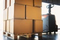 Packaging Boxes Stacked on Pallet with Electric Forklift Loader. Cartons, Cardboard Boxes. Shipping Supplies Warehouse Royalty Free Stock Photo