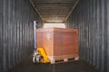 Packaging Boxes Stacked on Pallet with Hand Pallet Truck. Inside Shipping Cargo Container. Loading Trucks. Supply Chain Shipment. Royalty Free Stock Photo