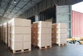 Packaging Boxes Stacked on Pallets Loading into Cargo Container. Delivery Shipping Trucks. Supply Chain Shipment Goods. Royalty Free Stock Photo