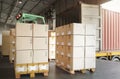 Packaging Boxes Stacked on Pallets Loading into Cargo Container. Shipping Trucks. Supply Chain Shipment. Distribution Supplies Royalty Free Stock Photo