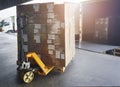 Packaging Boxes Stacked on Pallets Loading into Cargo Container. Shipping Trucks. Supply Chain Shipment. Distribution Supplies Royalty Free Stock Photo