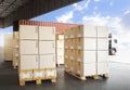 Packaging Boxes Stacked on Pallets Loading into Shipping Cargo Container. Delivery Trucks Parked Loading at Dock Warehouse. Royalty Free Stock Photo