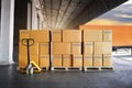 Packaging Boxes Stacked on Pallets Wating to Loading into Cargo Container. Cartons, Cardboard Boxes. Delivery Shipping Trucks.