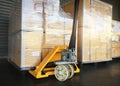 Packaging Boxes Wrapped Plastic Film on Pallets With Hand Pallet Truck. Storage Warehouse. Supply Chain. Storehouse Cargo Shipping Royalty Free Stock Photo