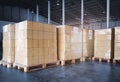 Packaging Boxes Wrapped Plastic Film on Pallets in Storage Warehouse. Supply Chain. Storehouse Commerce Shipment. Shipping Boxes. Royalty Free Stock Photo