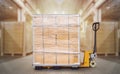 Packaging Boxes Wrapped Plastic on Pallet with Hand Pallet Truck. Distribution Warehouse. Shipment. Supplies Shipping Warehouse Royalty Free Stock Photo