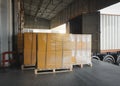 Packaging Boxes Wrapped Plastic on Pallets Loading with Shipping Cargo Container. Trucks Parked Loading at Dock Warehouse Shipment Royalty Free Stock Photo