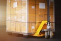 Packaging Boxes Wrapped Plastic Stacked on Pallets with Hand Pallet Truck. Distribution Warehouse. Cargo Shipment Supplies Royalty Free Stock Photo