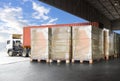 Packaging Boxes Wrapped Plastic Stacked on Pallets Loading into Cargo Container. Shipping Trucks. Supply Chain Shipment. Logistica Royalty Free Stock Photo