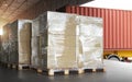 Packaging Boxes Wrapped Plastic Stacked on Pallets Loading into Cargo Container. Shipping Trucks. Supply Chain Shipment. Logistics Royalty Free Stock Photo