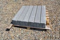 Packaging curb stone at the construction site. Pallet with concrete curbs for sidewalk construction Royalty Free Stock Photo