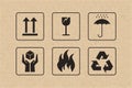 Packaging icon set of fragile care sign and symbol on brown cardboard. Royalty Free Stock Photo