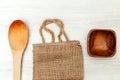 Packaging made from recycled materials and wooden items. Flat lay