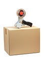 Packaging tape dispenser and shipping box Royalty Free Stock Photo