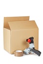 Packaging tape dispenser and shipping box Royalty Free Stock Photo