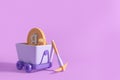 Packaxe and mining cart with golden bitcoins, copy space