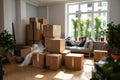 Packed boxes in a bright, empty apartment room awaiting relocation Royalty Free Stock Photo