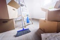 Packed cardboard boxes and stuff during moving into new home Royalty Free Stock Photo