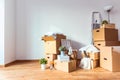 Packed cardboard boxes and stuff during moving into new home Royalty Free Stock Photo