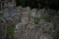 Packed cemetery with old decaying gravestones in church churchyard Royalty Free Stock Photo