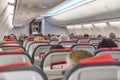 Packed comercial airplane interior. Travel transportation and tourism industry