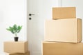Packed household stuff for moving into new house. Free space on cardboard box for your text